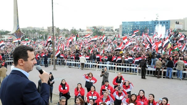 President Assad of Syria greeting a crowd in Damascus