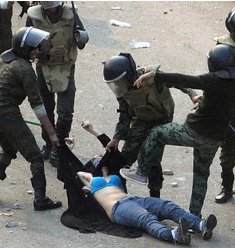 Egyptian soldiers beating up female protestor