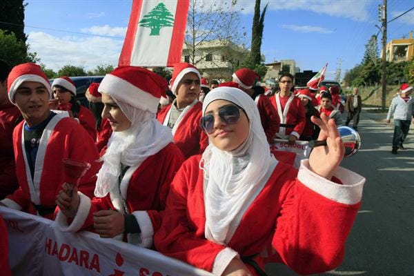 Lebanese veiled woman wearing Santa-Claus costume